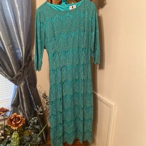 Dainty jewell’s dress teal. Comes with ribbon belt